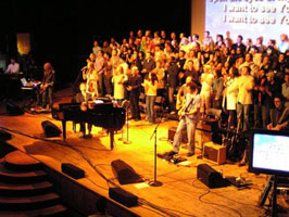 The crowded stage of Sunday Evening Worship